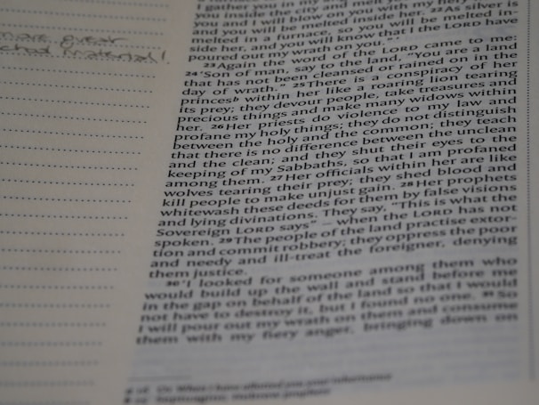 A close-up of a well-worn copy of a theology book with handwritten notes in the margins.