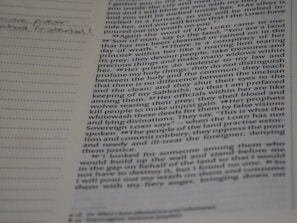 A close-up of an open Bible with highlighted text and colorful notes.