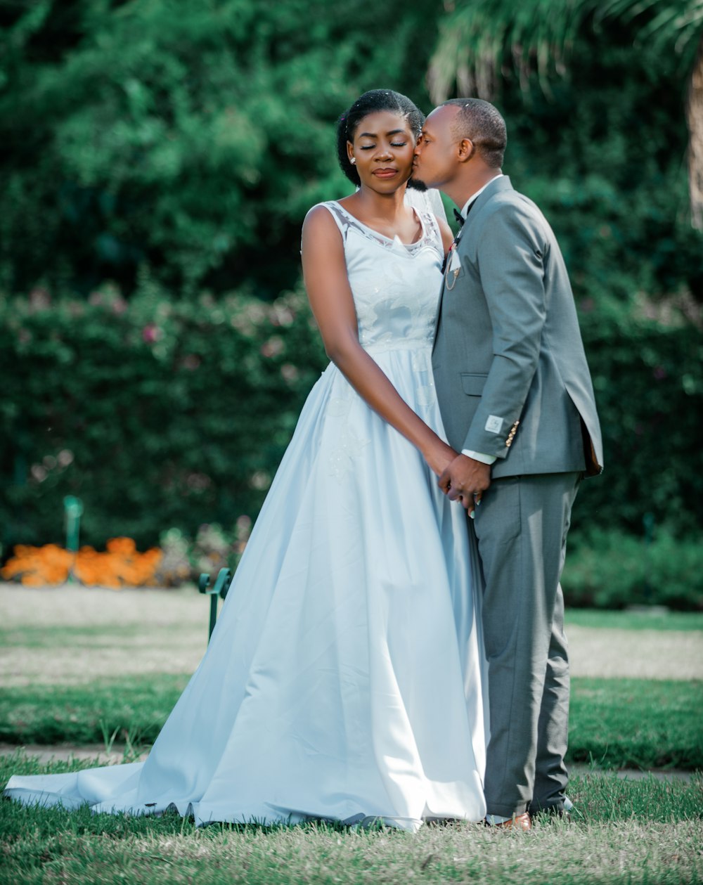 a bride and groom pose for a wedding photo