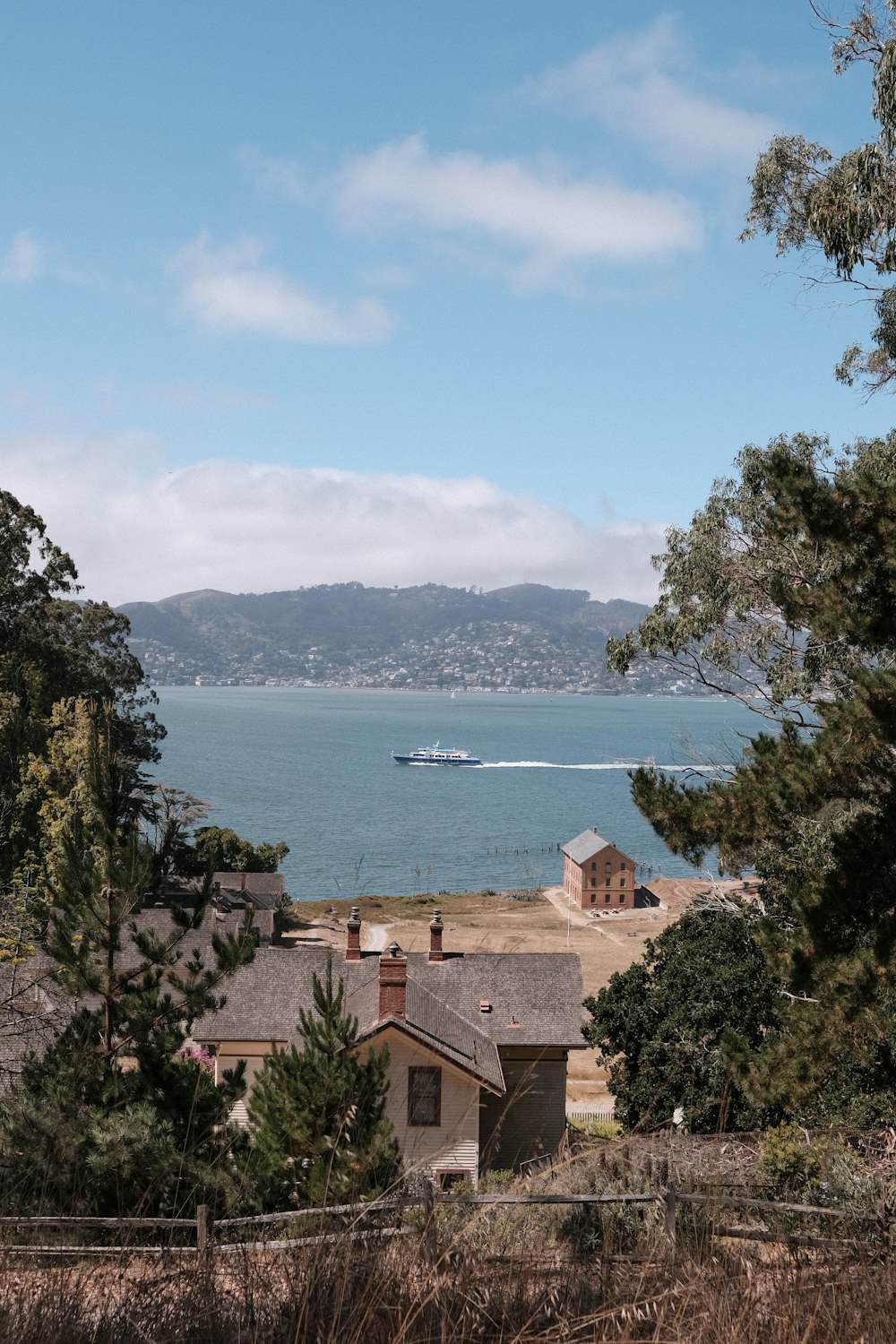 a view of a body of water with a boat in the distance