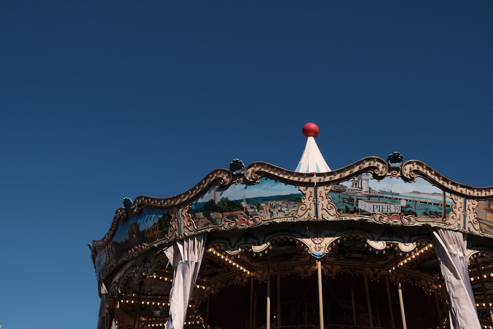 a close up of a merry go round on a clear day