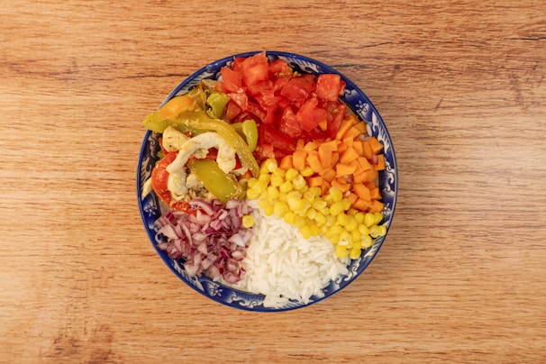 Close-up of a vibrant bowl filled with colorful vegetables and perfectly cooked rice.