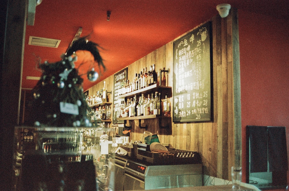 a bar with a bunch of bottles on the wall