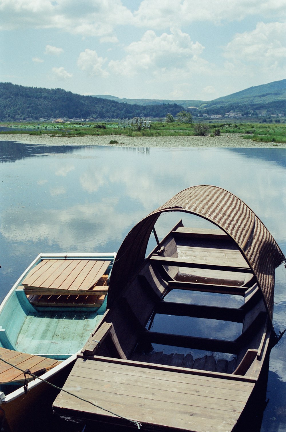 a row boat sitting on top of a lake