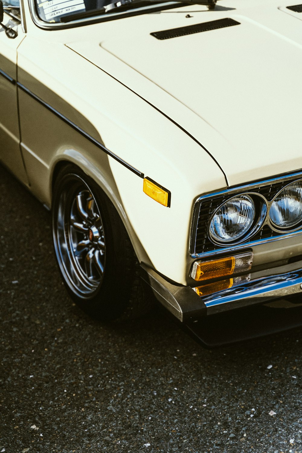 a white car parked on the side of the road