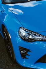 a close up of a blue sports car