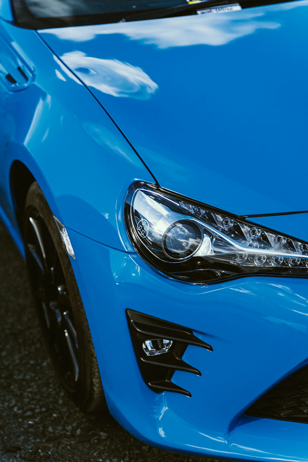 a close up of a blue sports car