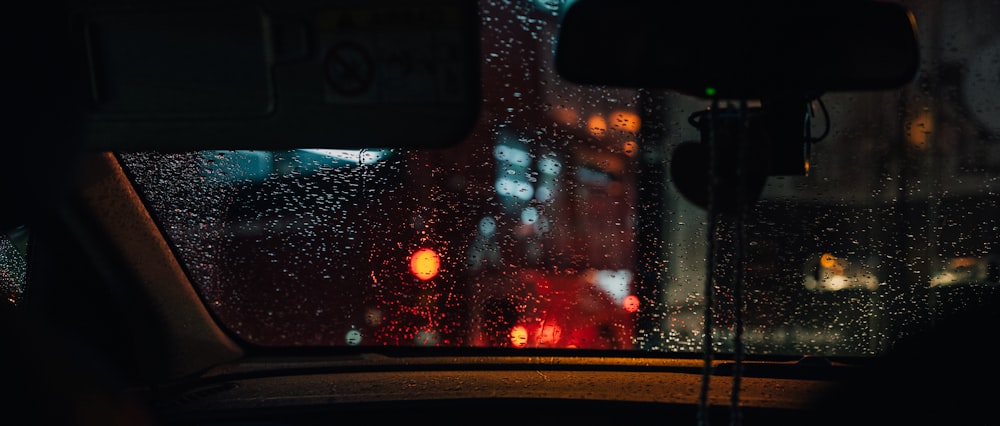 a view of a rainy street from a car window