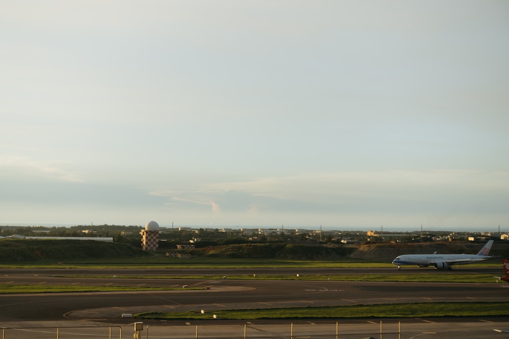 a large jetliner sitting on top of an airport tarmac