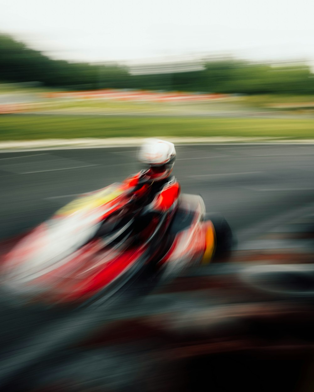 a person riding a motorcycle on a race track