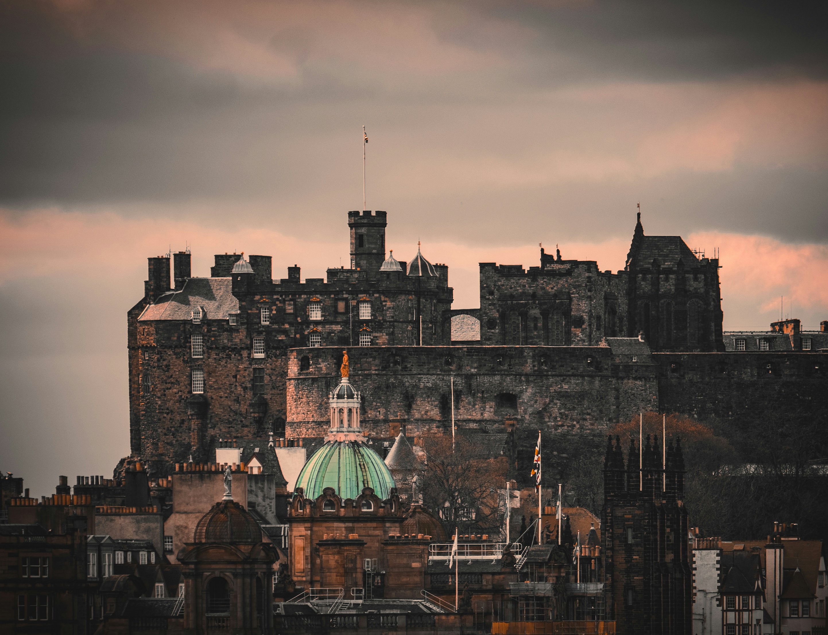 a large building with a green dome on top of it, 