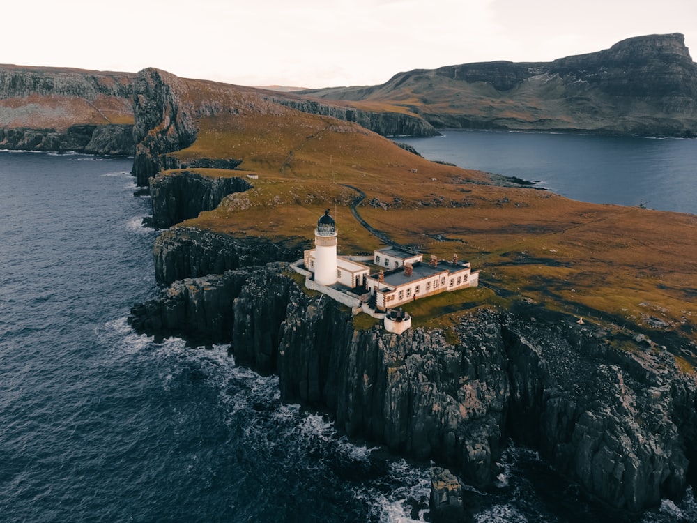 an aerial view of a lighthouse on an island