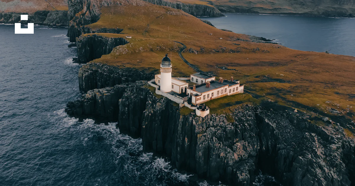 An aerial view of a lighthouse on an island photo – Free Neist point ...