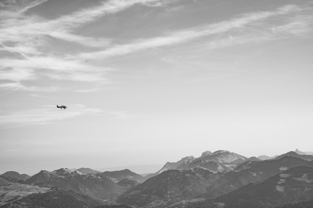 an airplane is flying over a mountain range