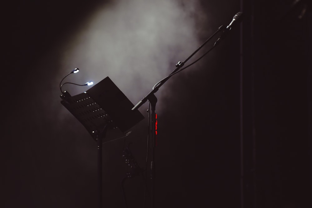 a microphone on a stand in front of a microphone stand