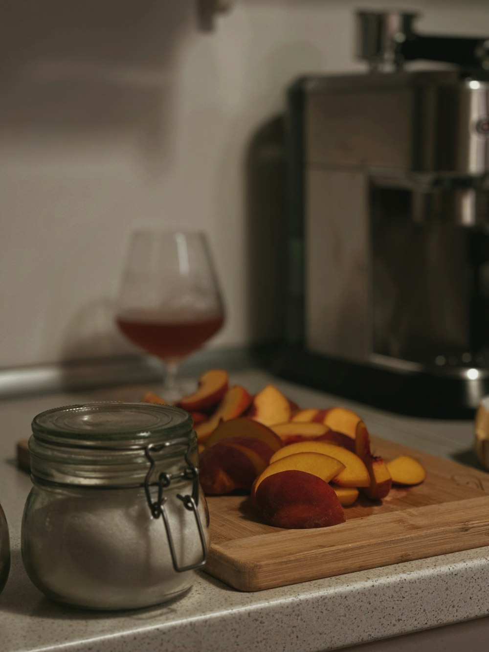 a wooden cutting board topped with sliced peaches