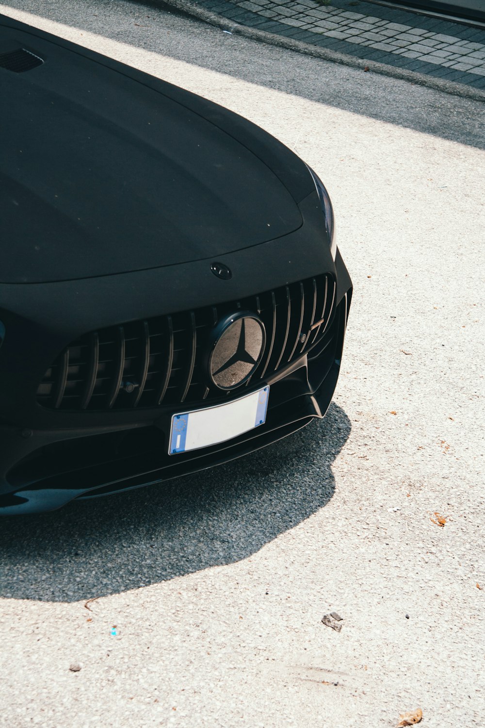 a close up of the front of a black sports car