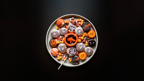 a white plate topped with lots of halloween candies