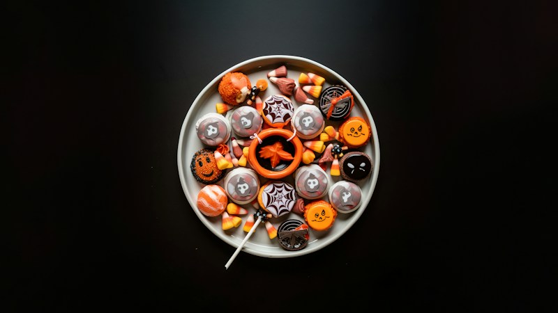Plate piled with wrapped Halloween candy, the kind of treats kids collect at trick-or-treat stations in Las Vegas