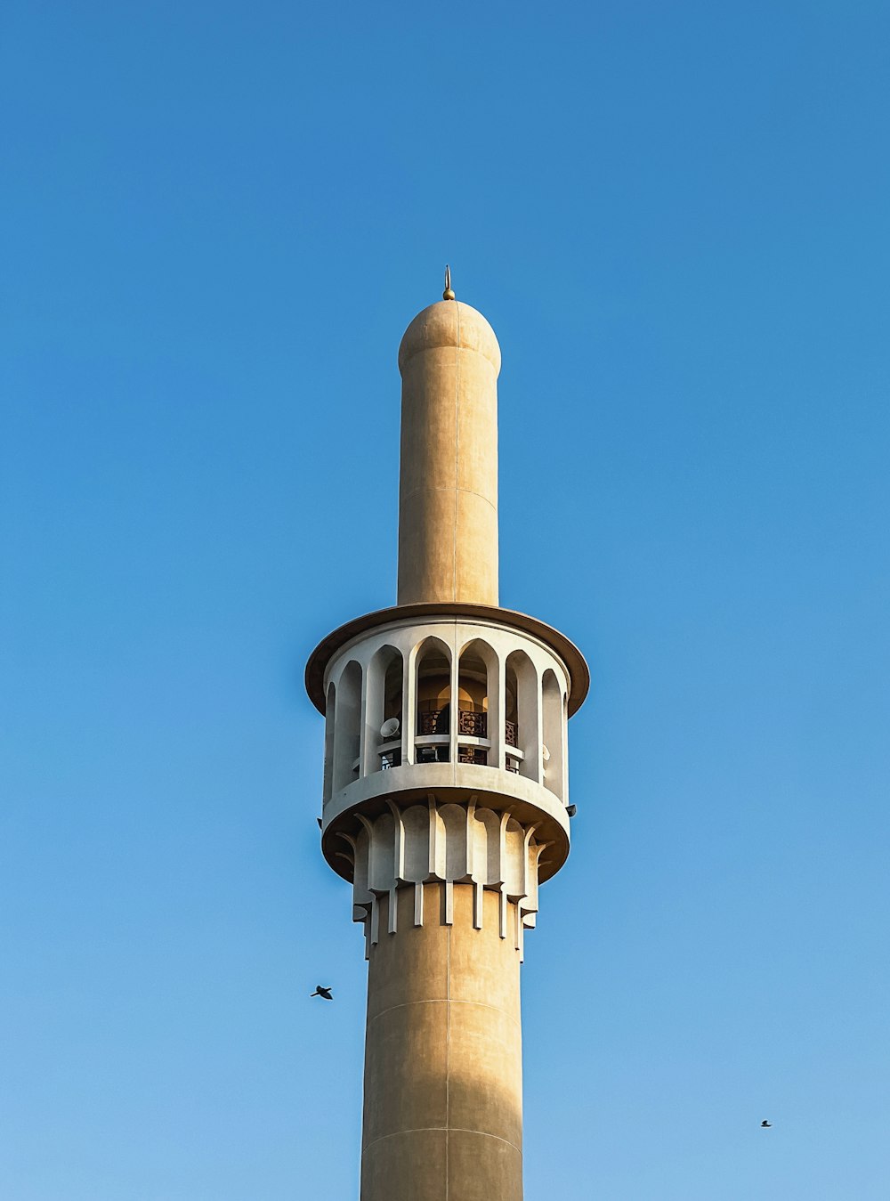 a tall tower with a clock on the top of it