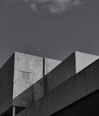 Photo of a minimalist roster beton ventilasi integrated into a sleek modern building facade.