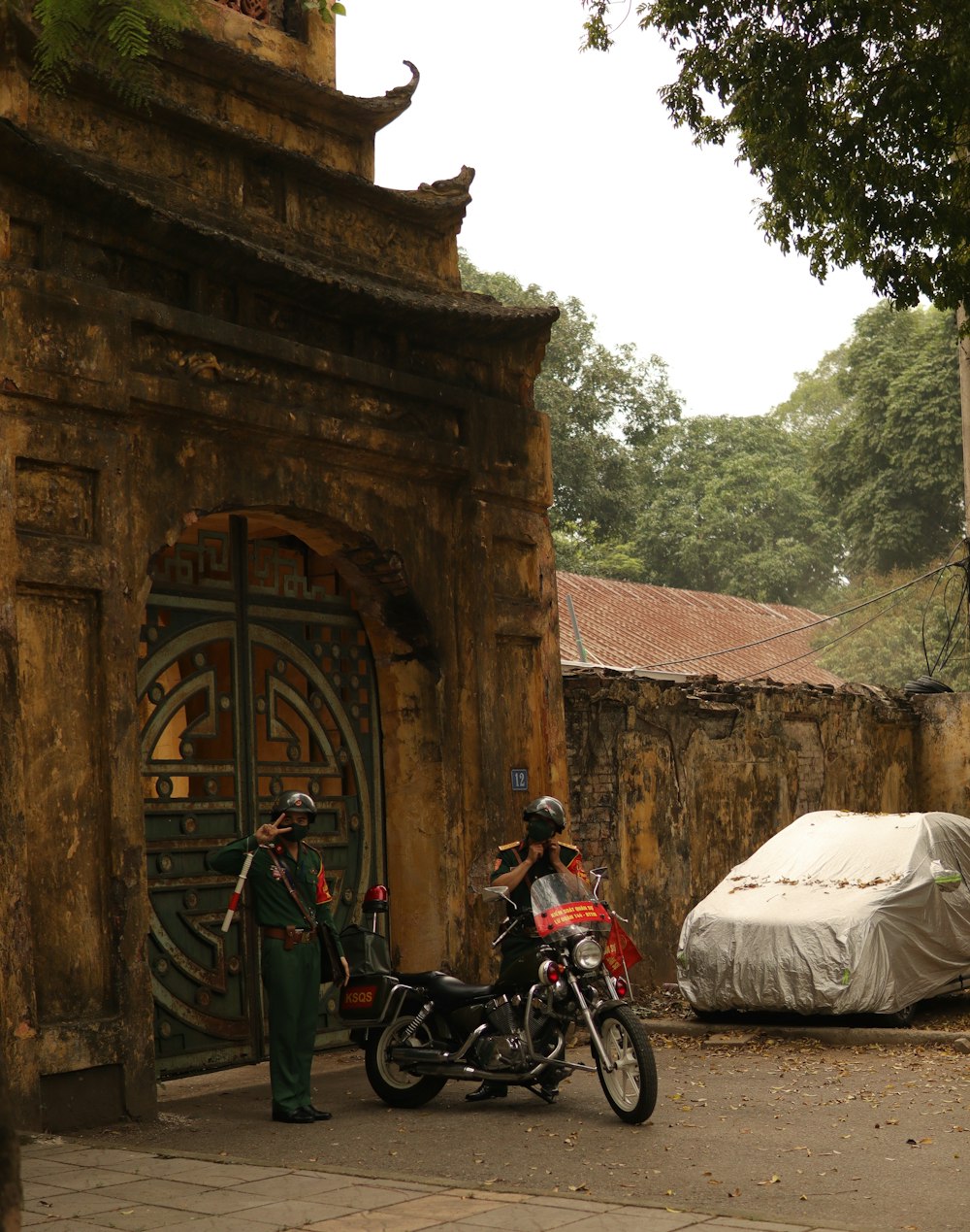 a motorcycle parked in front of a stone building