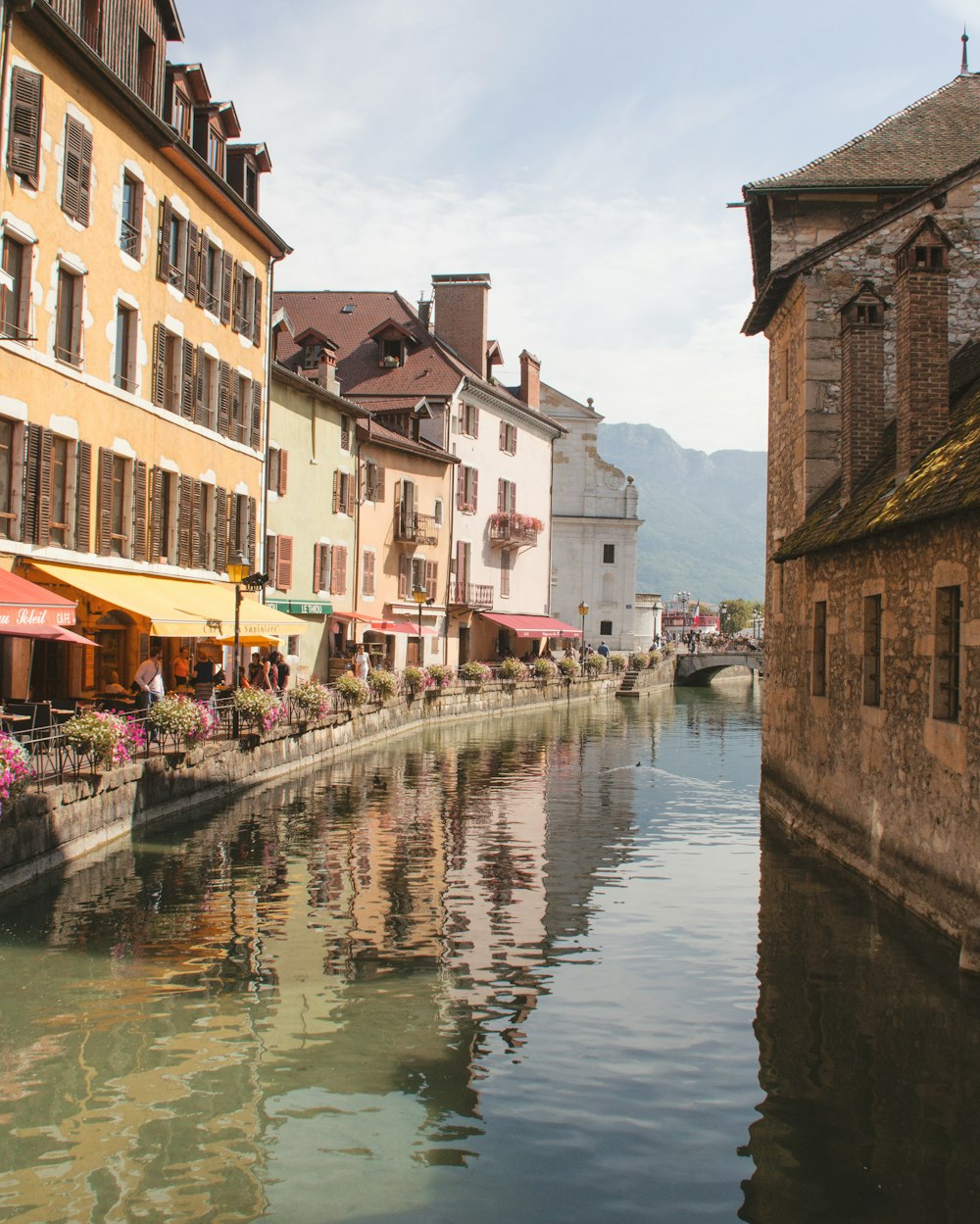 a river running through a city next to tall buildings