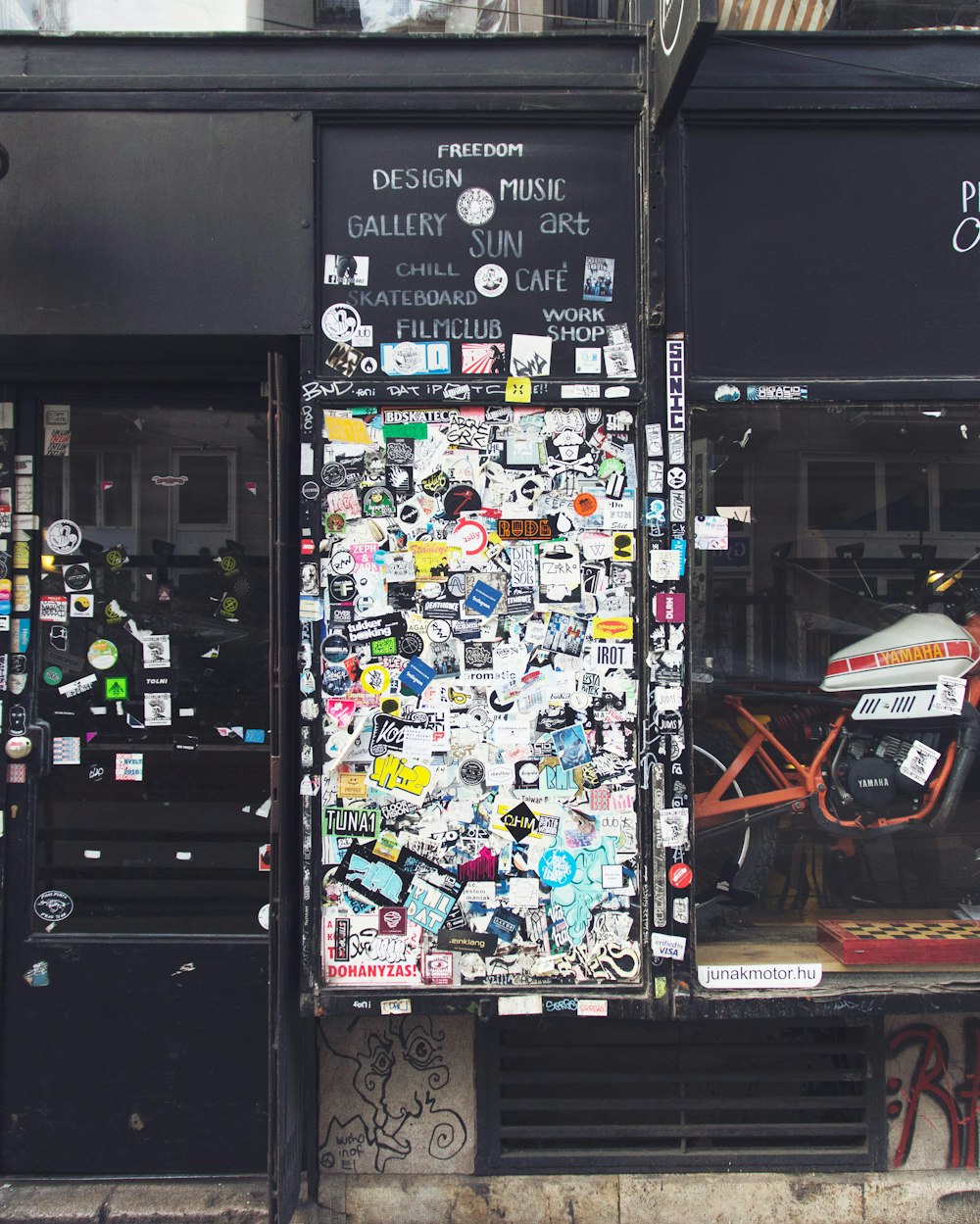 a motorcycle parked in front of a store front