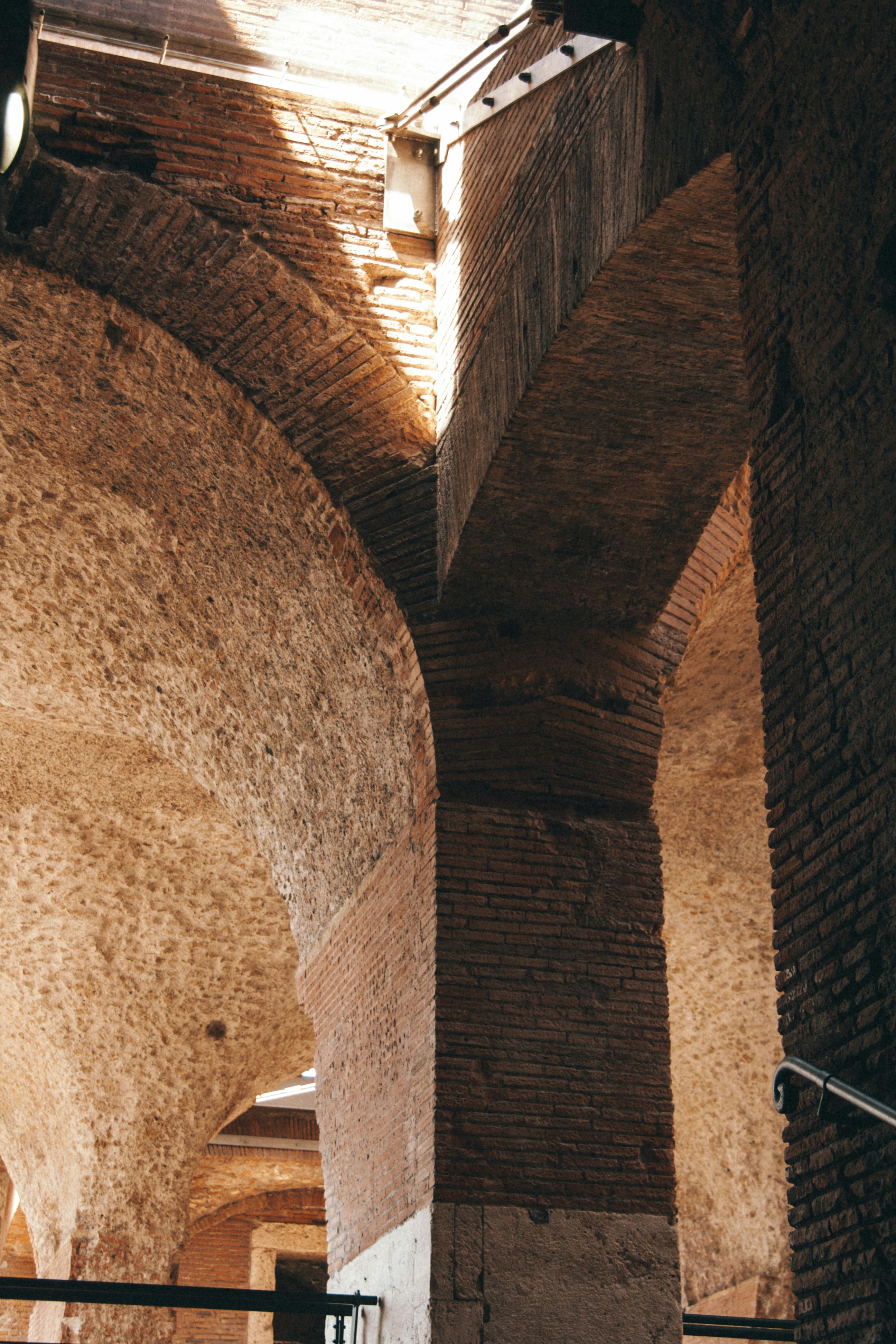 a view of a very tall brick structure with a clock on it