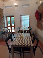 Modern wooden dining table set in a cozy home environment with natural light.