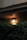 An outdoor scene featuring Chelans wall lantern illuminating a cozy patio.