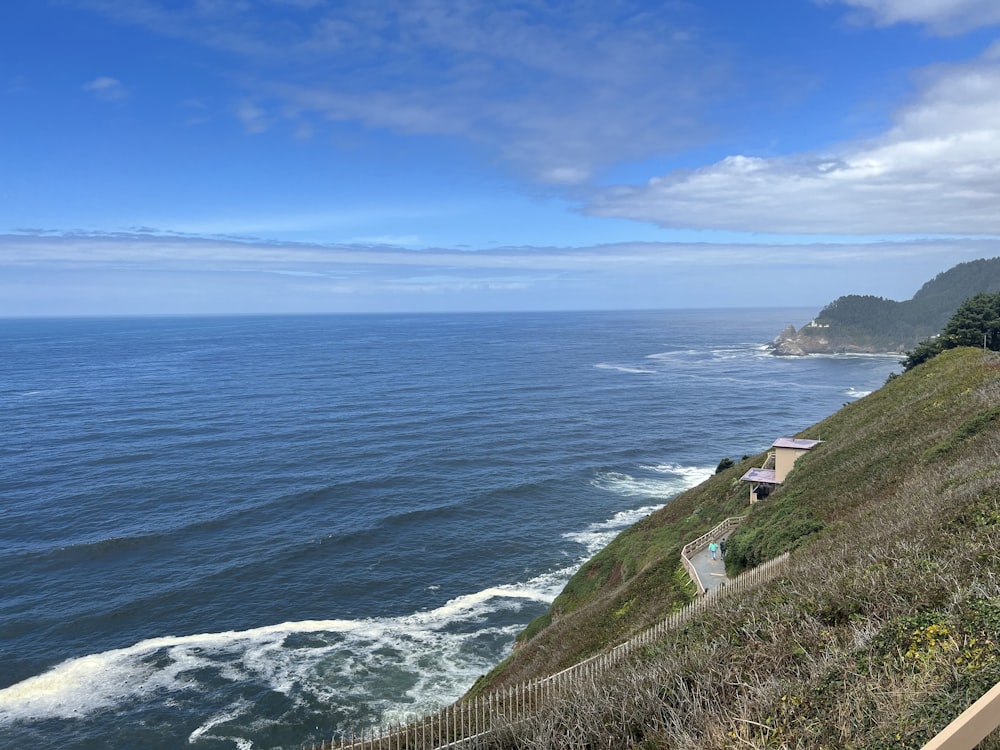 a scenic view of the ocean from a hill