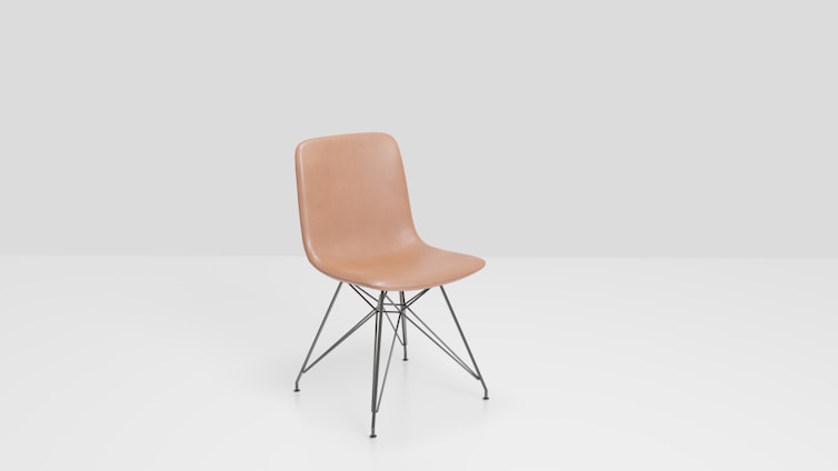 A tan molded plastic chair with a minimalist design sits on black metal legs with cross-bracing. The background is a simple light gray, enhancing the chair's modern aesthetic.