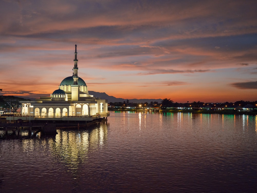 a large building sitting on top of a body of water