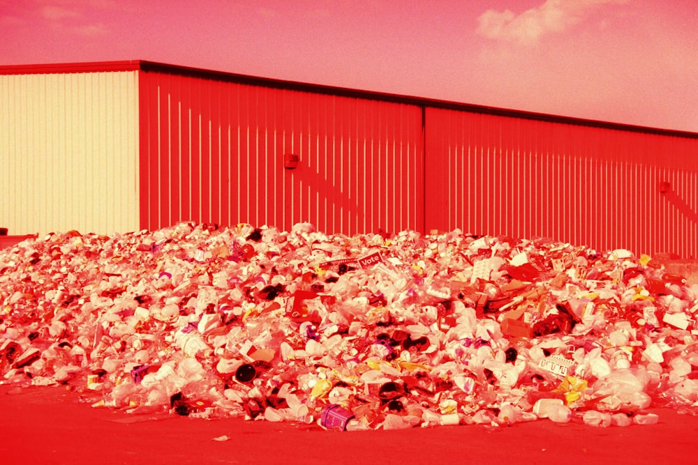 a large pile of trash sitting in front of a building