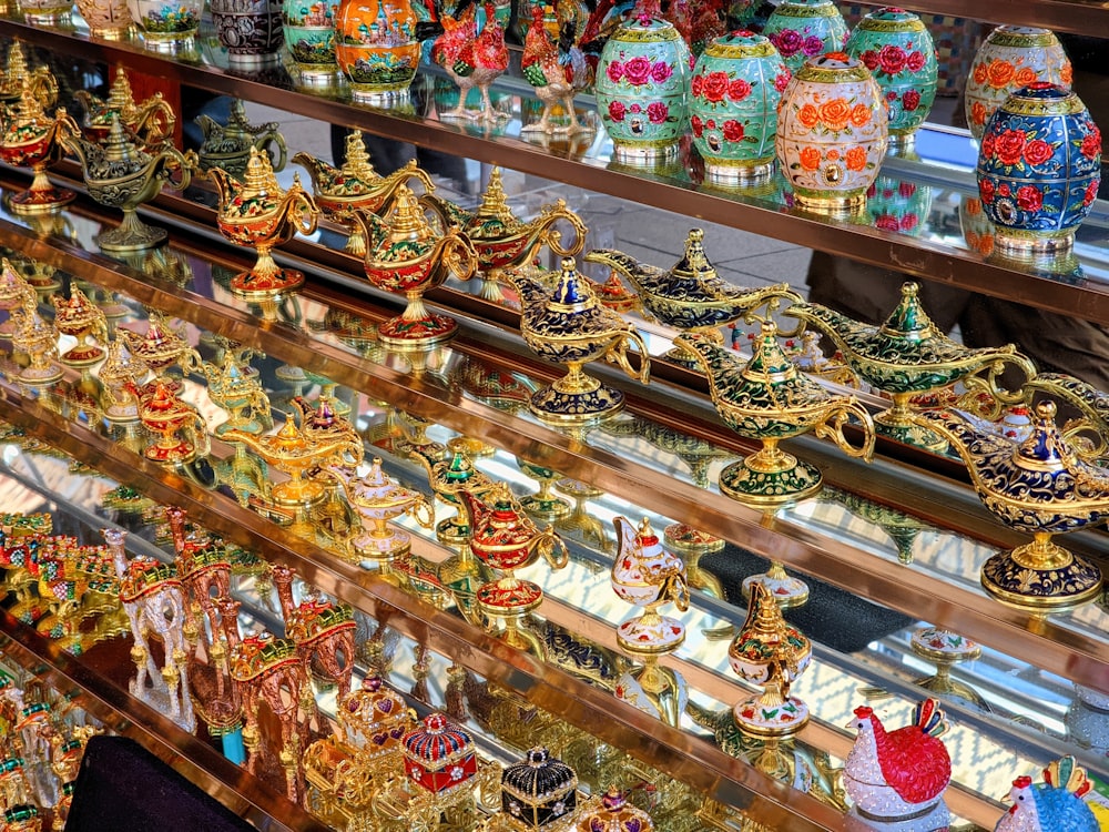 a display case filled with lots of colorful vases