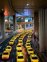A fleet of clean, modern taxis lined up ready for service.