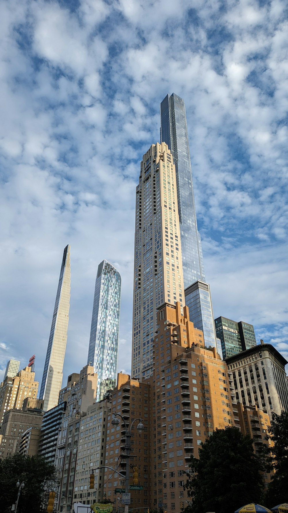 a very tall building surrounded by other tall buildings