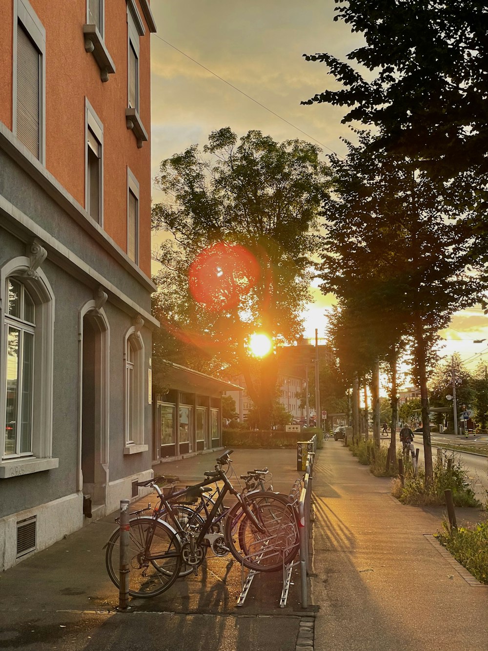 a couple of bikes parked on the side of a road