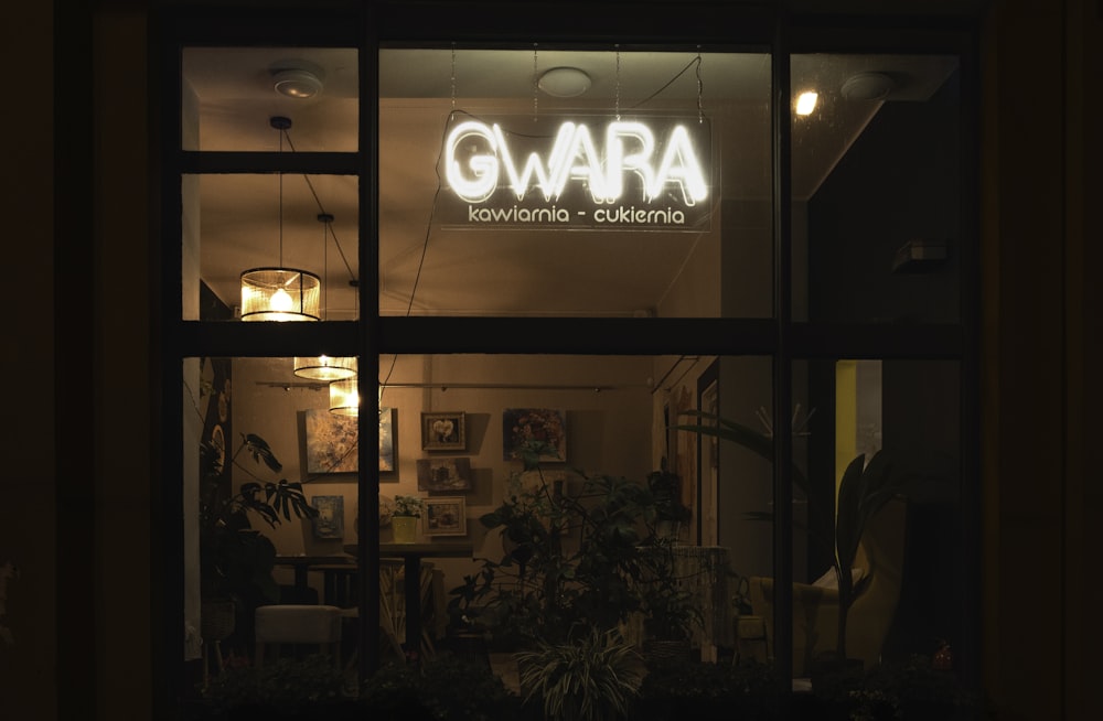 a dark room with a sign that reads gwara