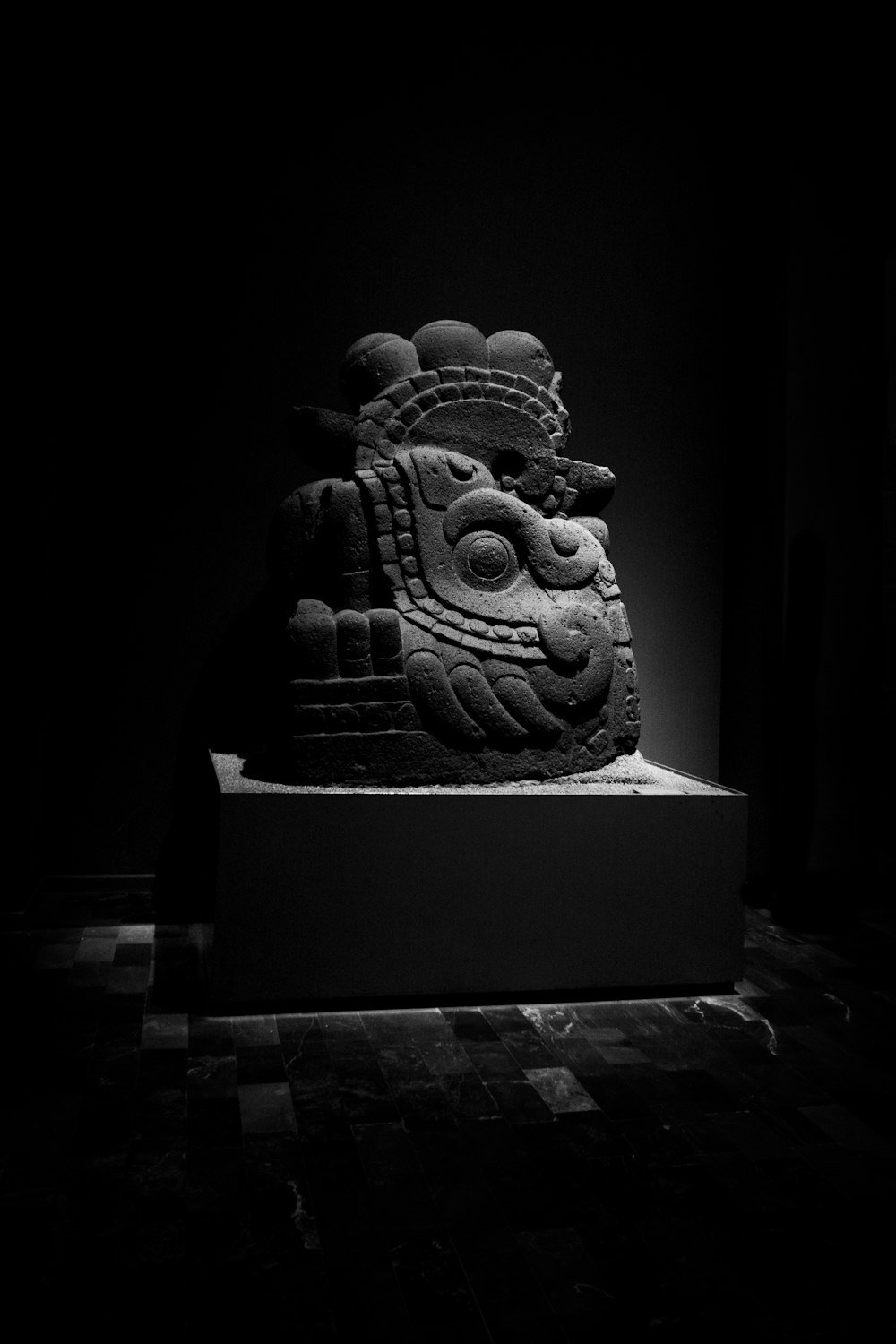 a black and white photo of a statue