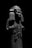 A stone sculpture of a figure with a headdress and patterned garment. The sculpture is worn and partially damaged, with a focus on intricate details in its attire.
