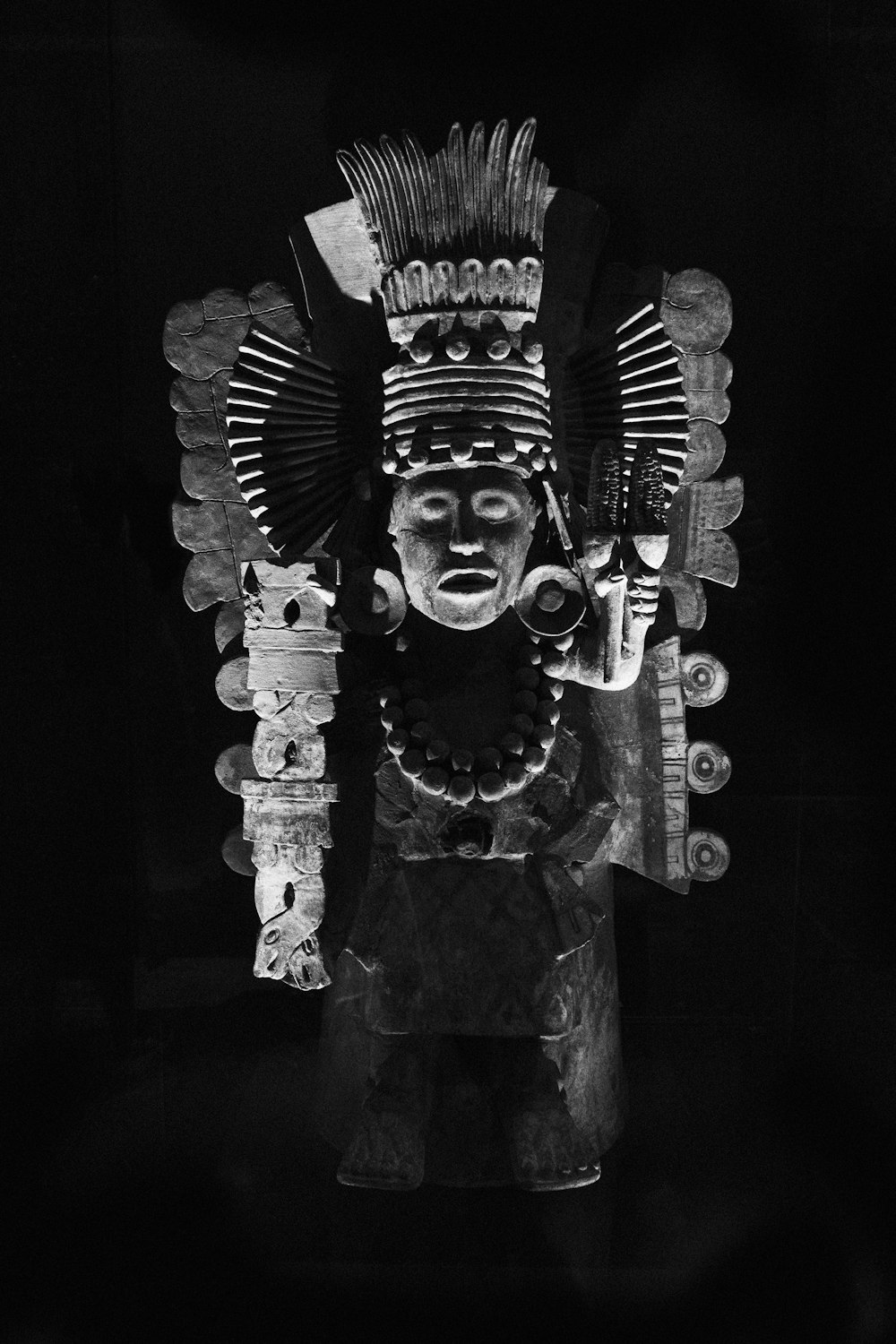 a black and white photo of a statue