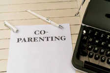 a piece of paper with the words co - parenting on it next to a