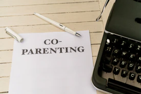 a piece of paper with the words co - parenting on it next to a