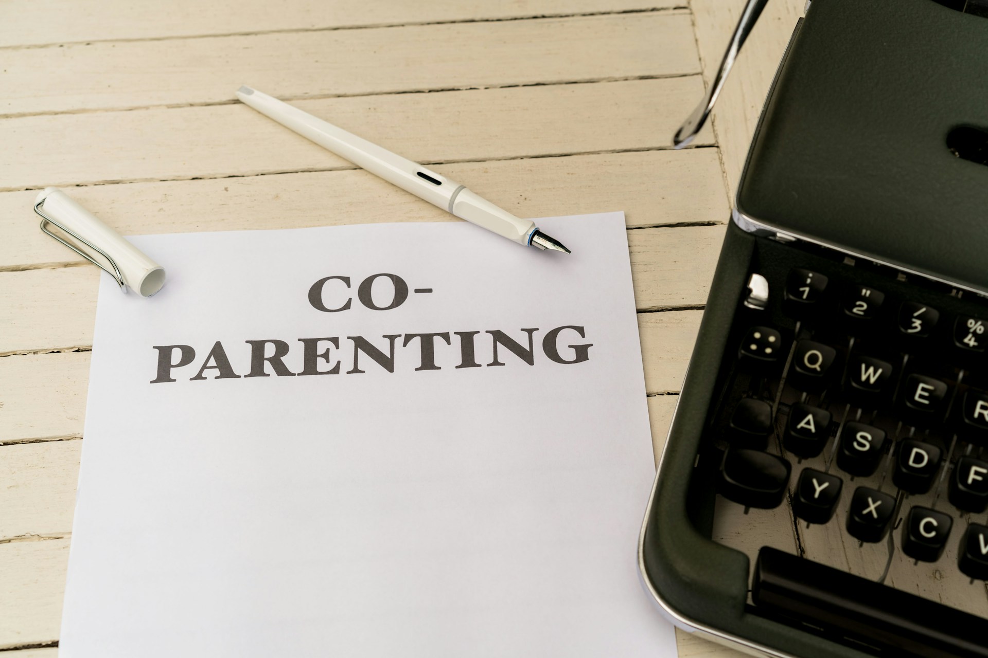 a piece of paper with the words co - parenting on it next to a