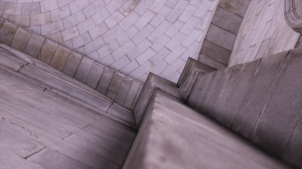 a man riding a skateboard down the side of a cement wall