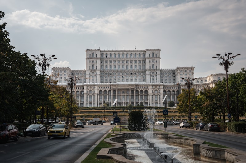 a large building with a fountain in front of it