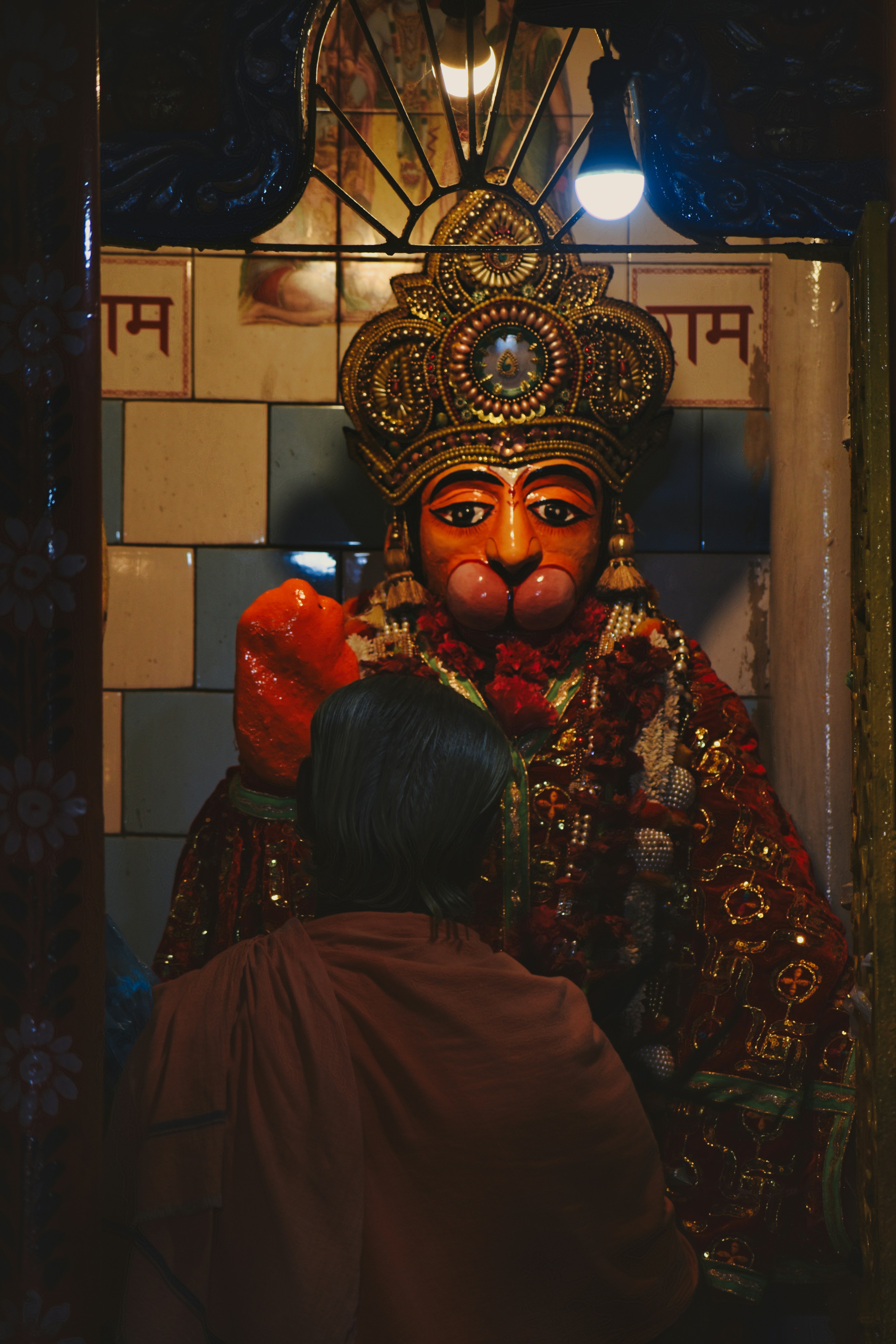 a man standing next to a statue of a person