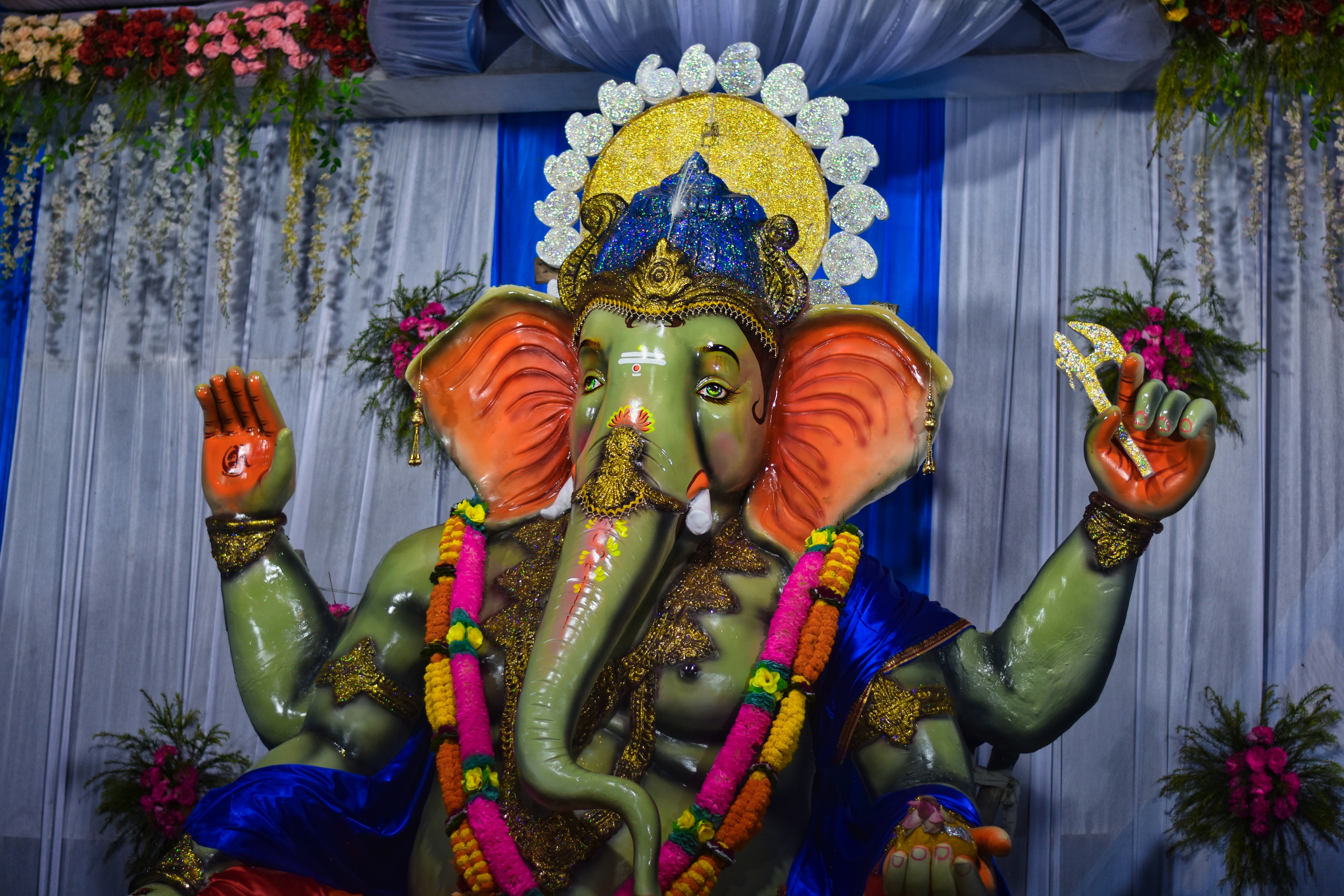 a statue of an elephant with a crown on it's head